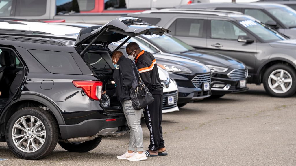 Carmakers face a crossroads as they work to fit auto dealers into their EV plans