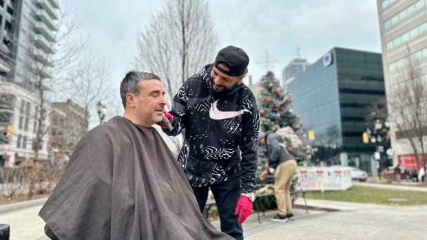 Barber gives free haircuts at downtown Hamilton park to those in need. He’s paid ‘in conversations’