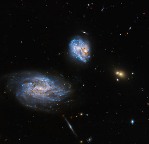 Hubble Space Telescope Captures Dance of Two Spiral Galaxies