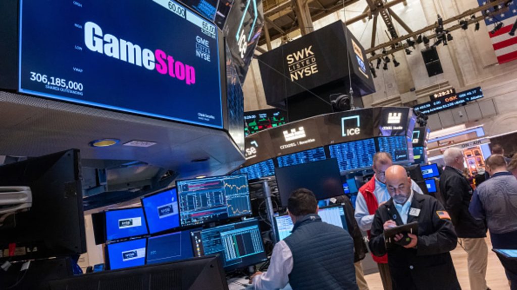 GameStop shares give up gain after retailer reports 29% sales decline, reveals plan to sell more stock