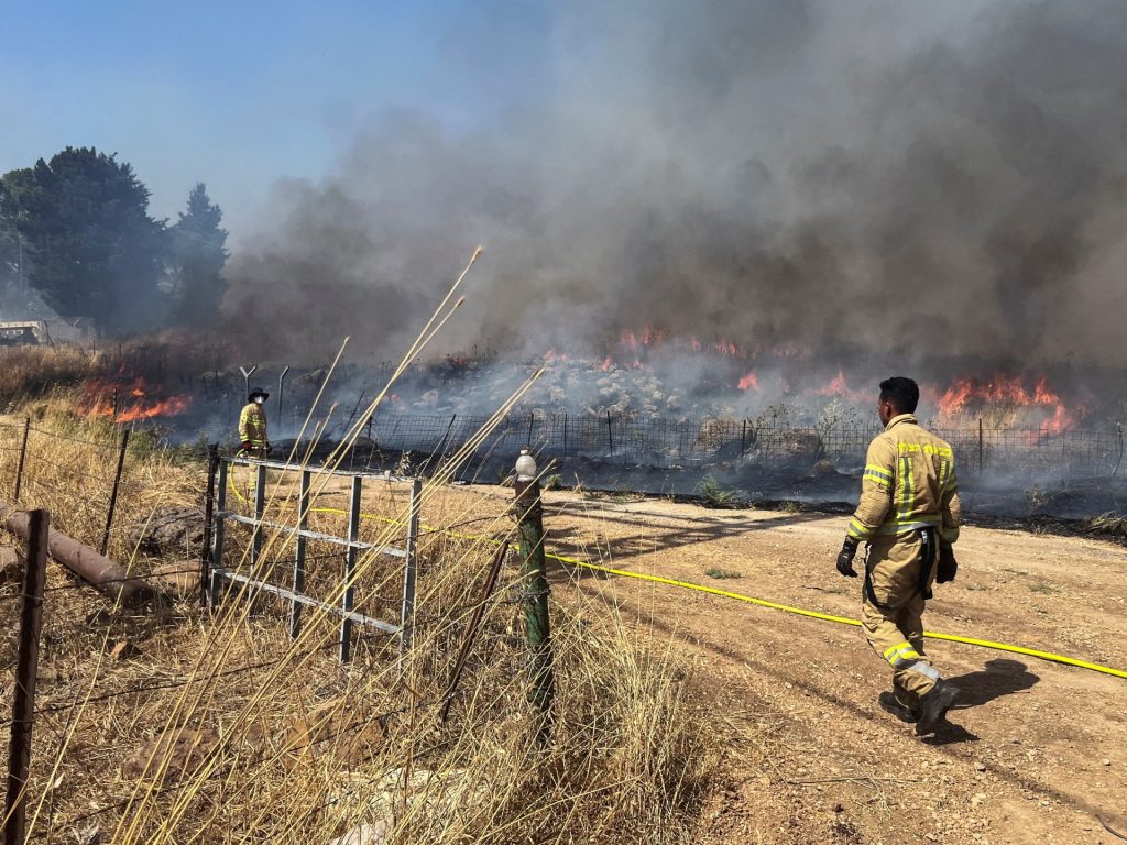 Hezbollah launches rockets, drones at northern Israel military sites