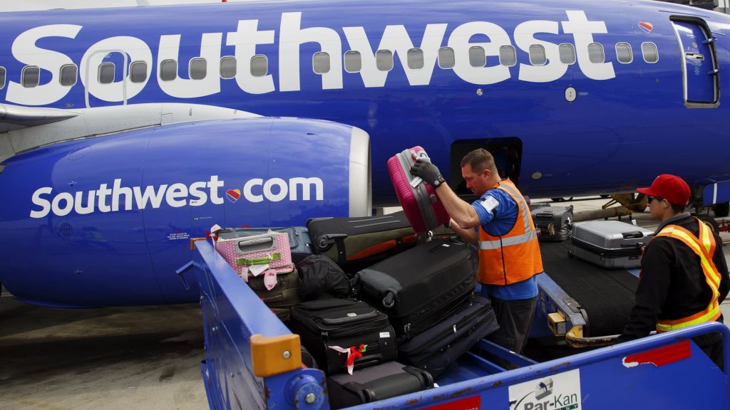 Southwest Airlines will charge to check bags for the first time, launch basic economy tickets